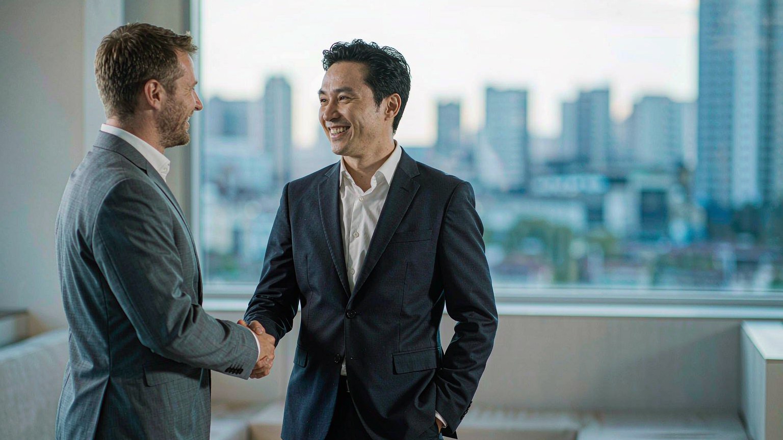 Chinese sourcing agent shaking hands with an overseas buyer
